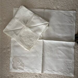 Leacock Elegant White Embroidered Table napkins and place settings. Set of 8